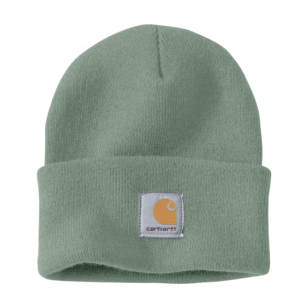 A green knit cuffed beanie with the Carhartt brand label displayed on the fold.