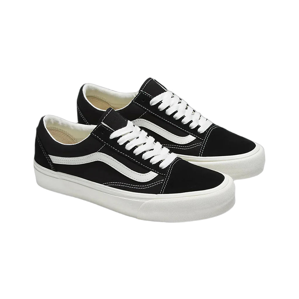 A pair of Vans Old Skool Vr3 sneakers in black and white color, featuring the brand's classic waffle outsole.