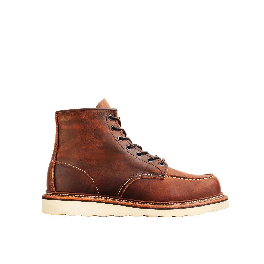 Brown leather boot with white sole on a white background
