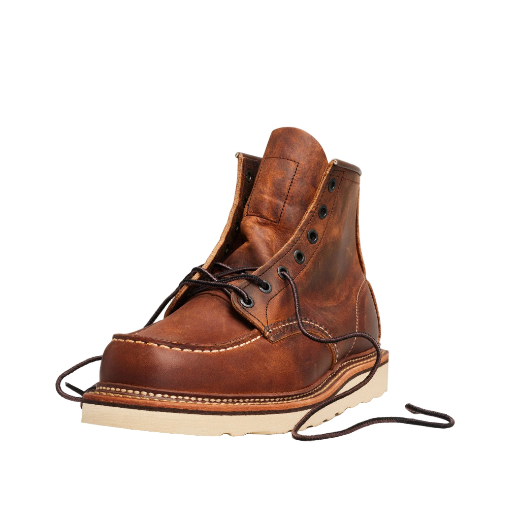 Brown leather boot with a white sole on a white background
