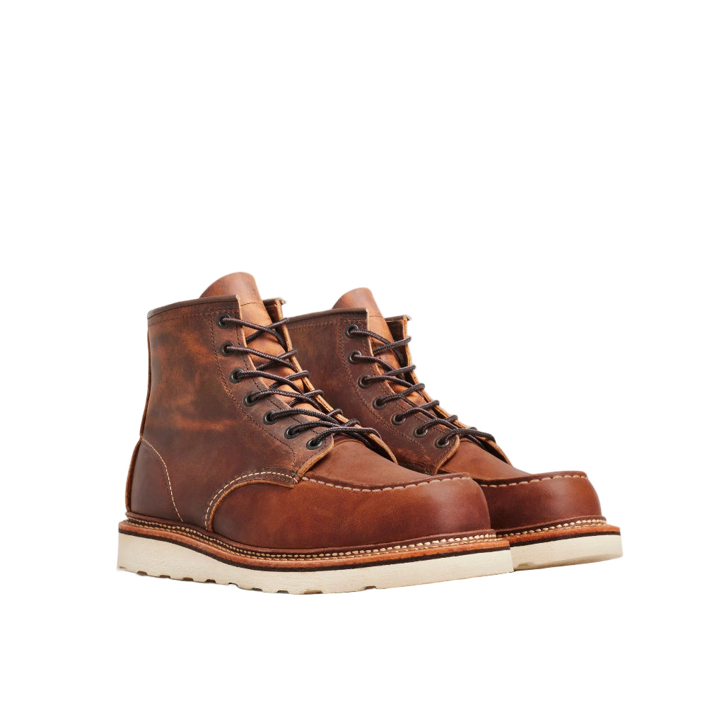 Pair of brown leather boots on a white background