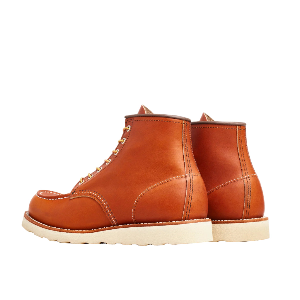 Pair of brown leather boots on a white background