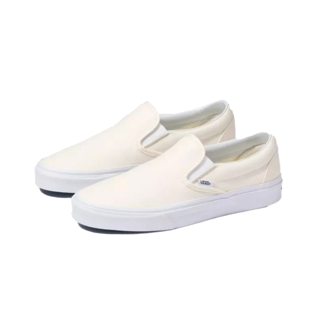 Cream slip on vans best sale