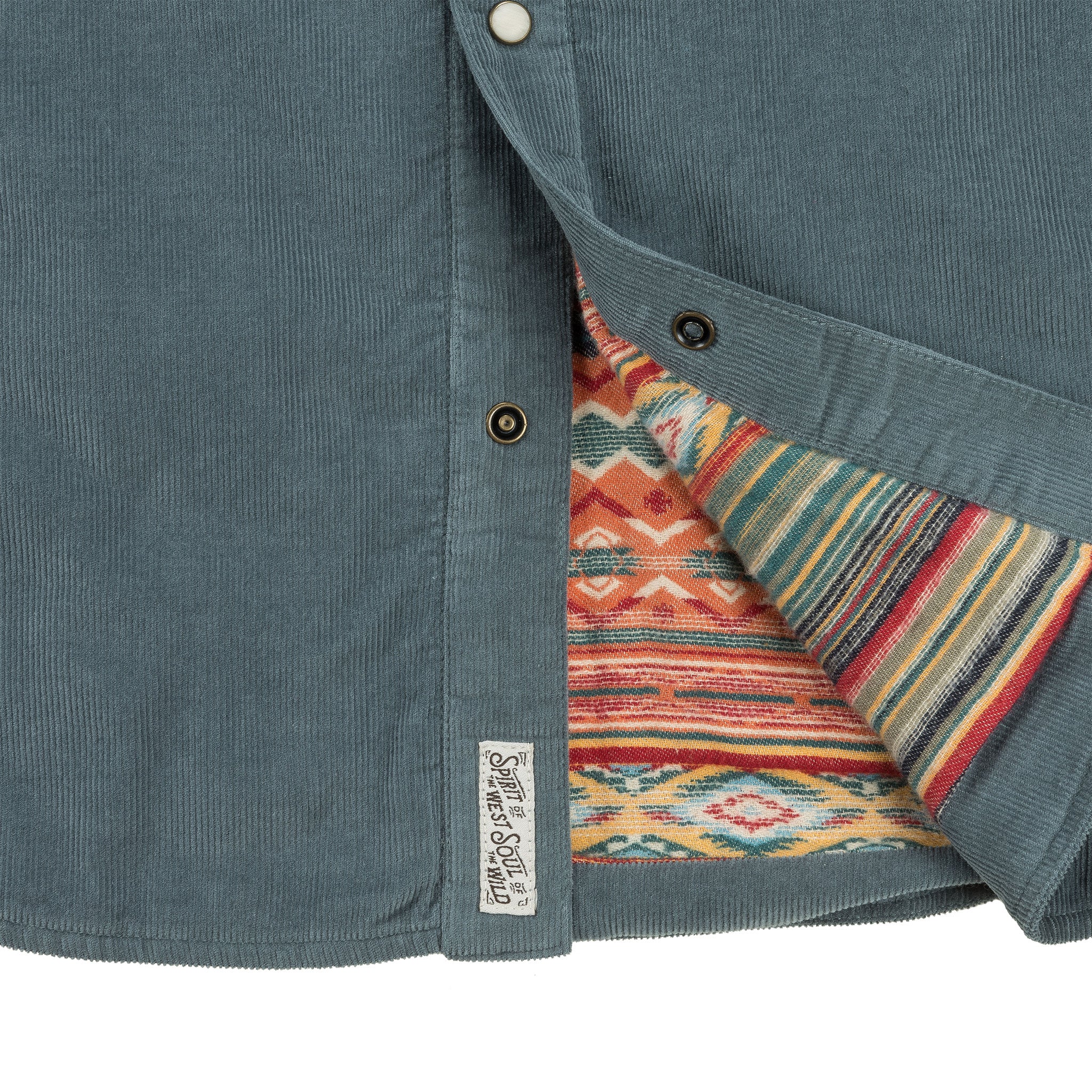 Close-up of a teal jacket with a colorful patterned lining, featuring a brand label.