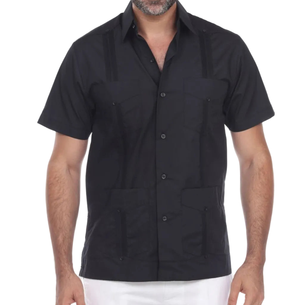 Man wearing a black short-sleeve shirt with button details on a white background