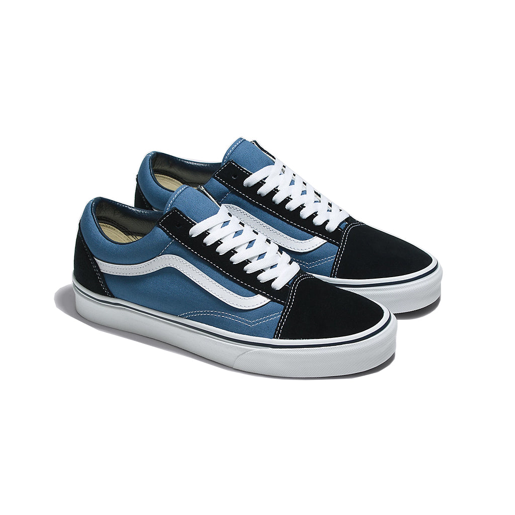 A pair of Vans Old Skool navy skate shoes with white laces and a black-to-navy color transition on the upper side.