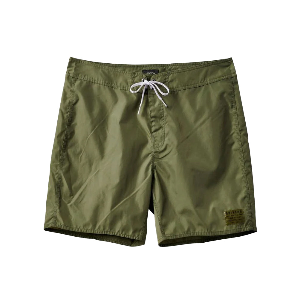 A pair of olive green nylon shorts with a drawstring waist and a front pocket, featuring a rubber logo patch on the front.