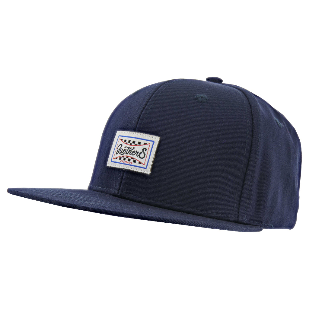 A navy blue checkered flag hat with a badge on the front.