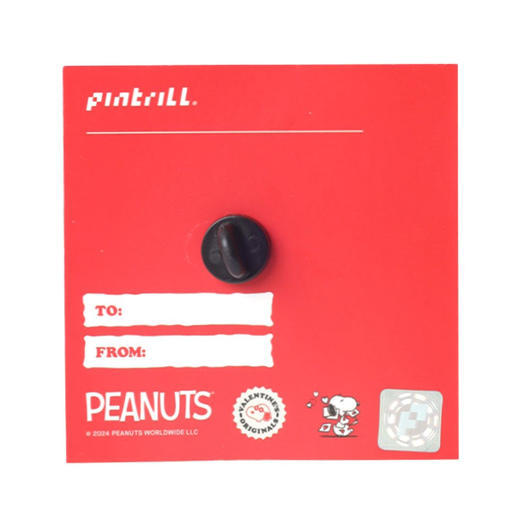 Black pin back on a red card with 'Pentrill' branding and 'Peanuts' logo.