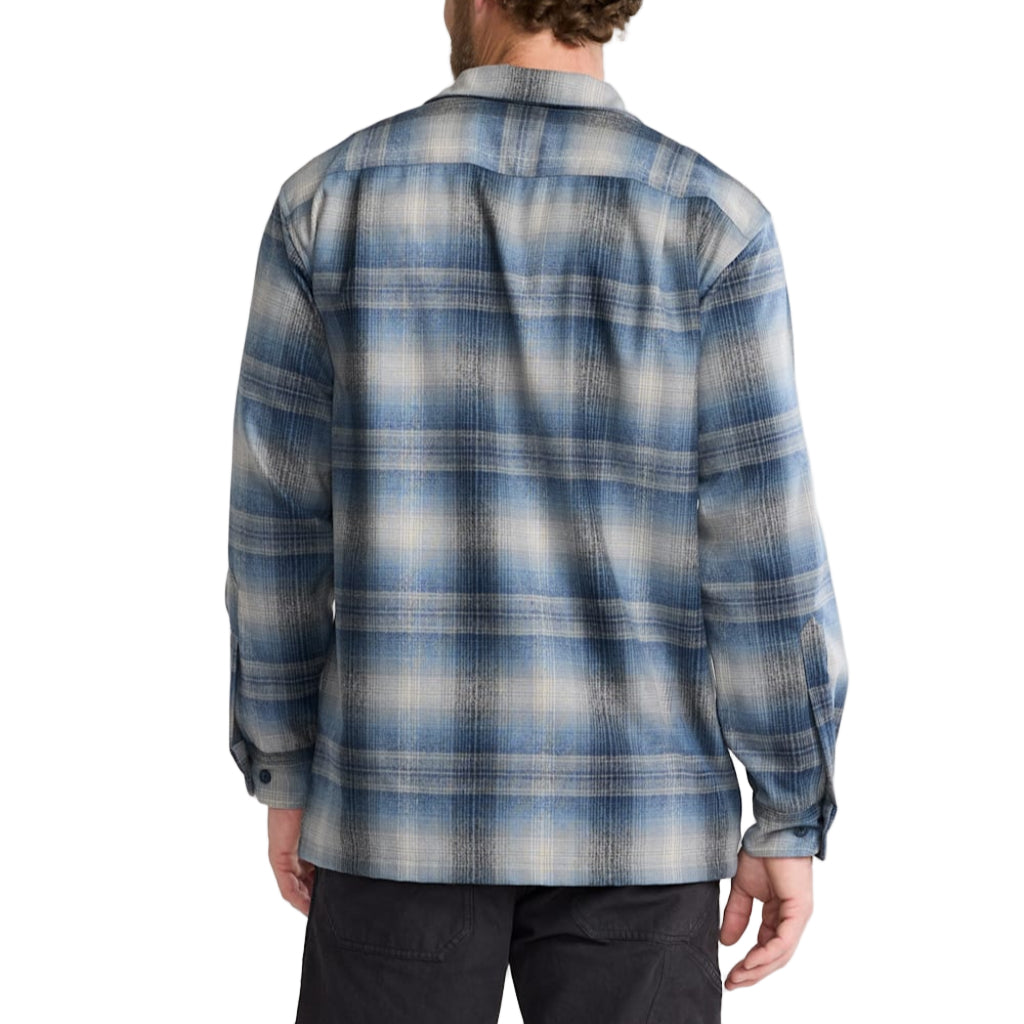 Person wearing a blue plaid shirt on a white background
