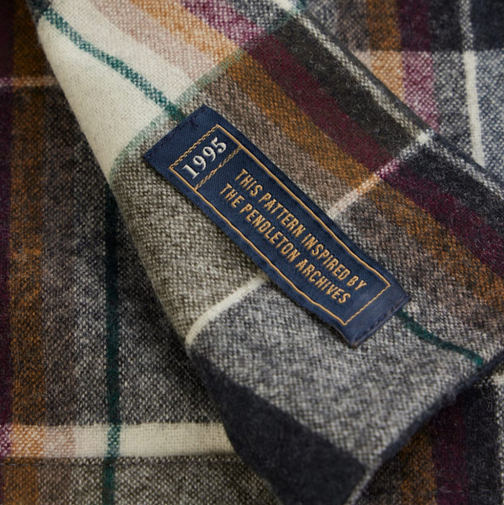 Plaid fabric with a label indicating inspiration from Pendleton Archives