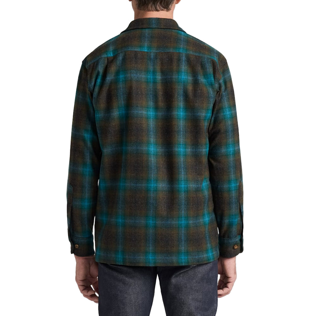 Man wearing a plaid shirt with a white background