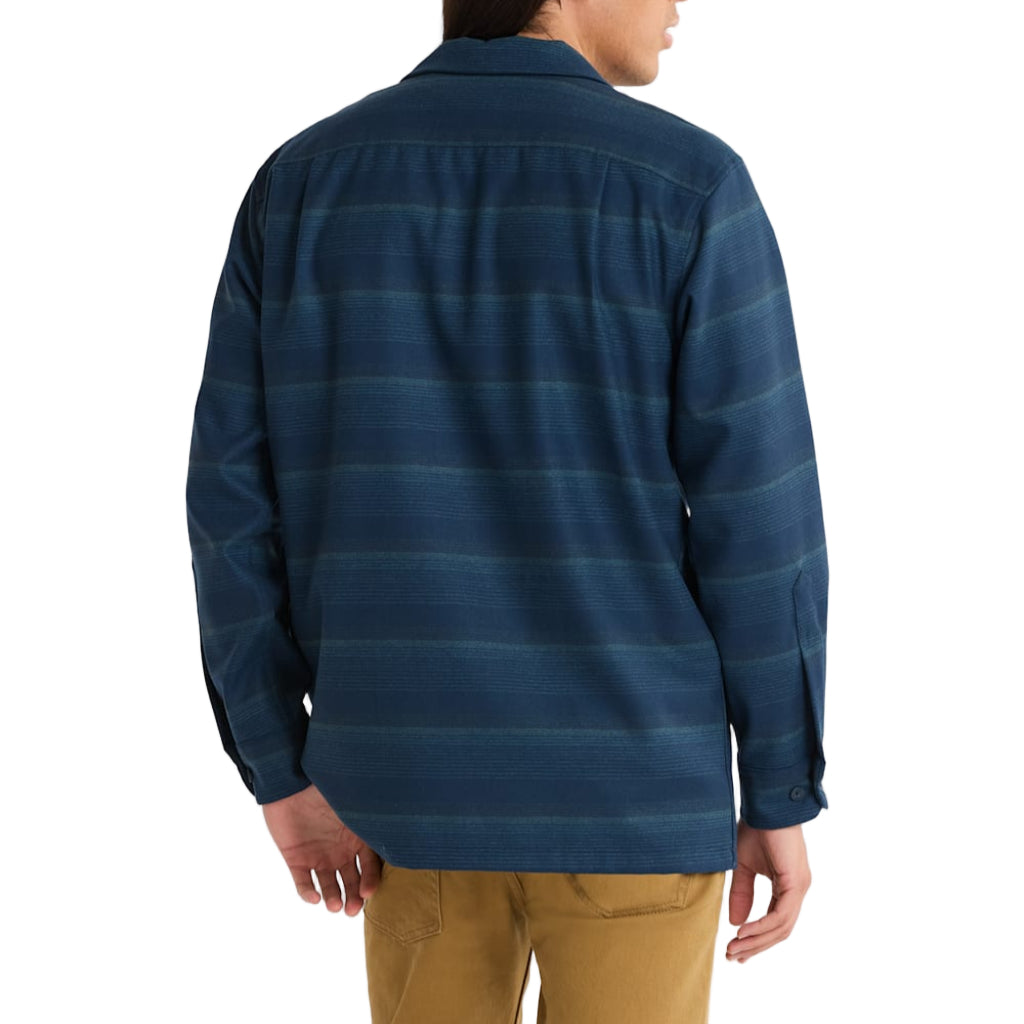 Person wearing a blue striped shirt on a plain background