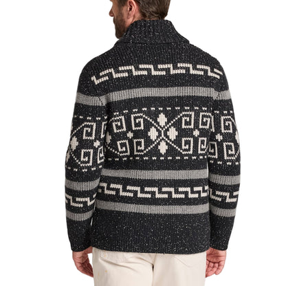 Man wearing a black patterned sweater on a white background