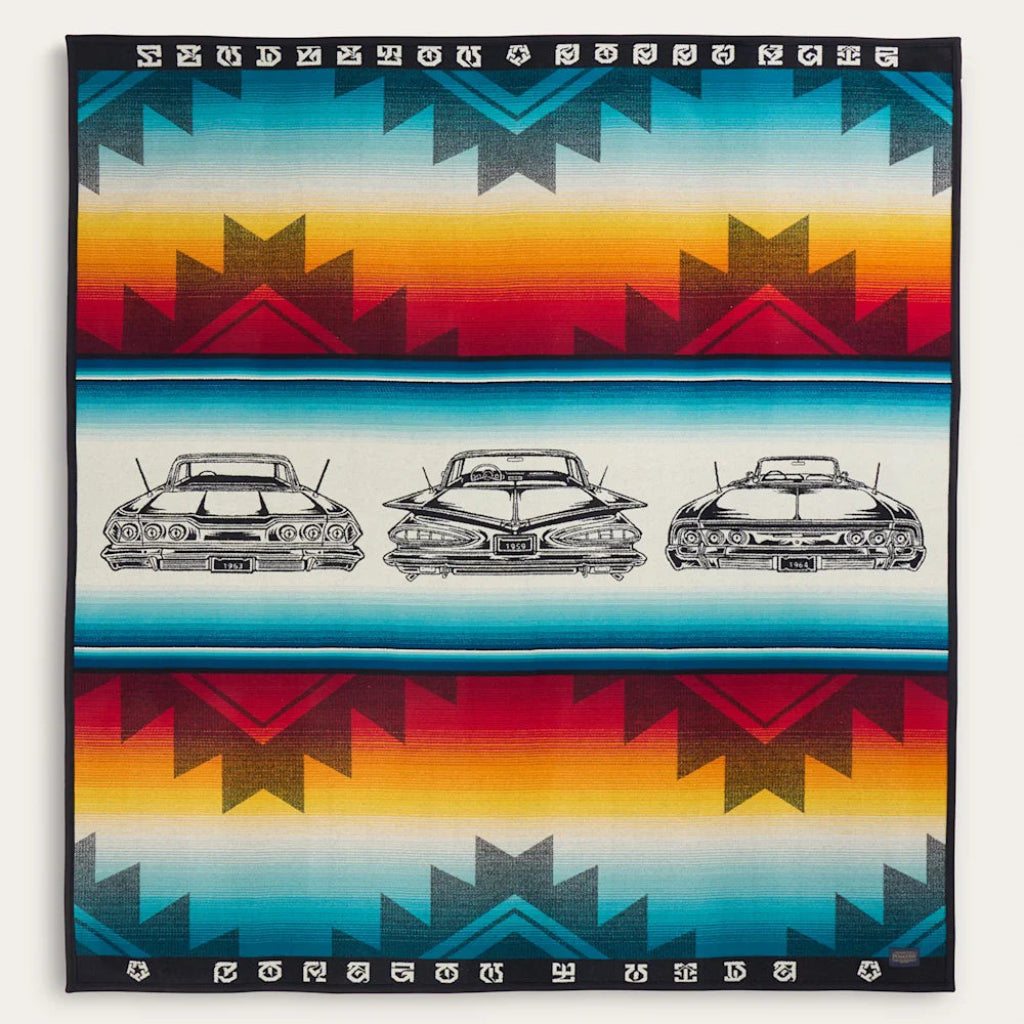 Festive blanket with geometric pattern and vintage car design on a white background