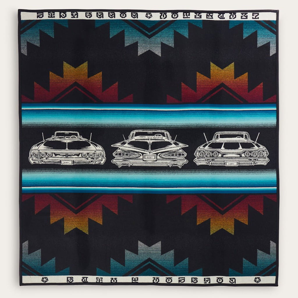 Blanket with vintage car design and geometric pattern on a black background