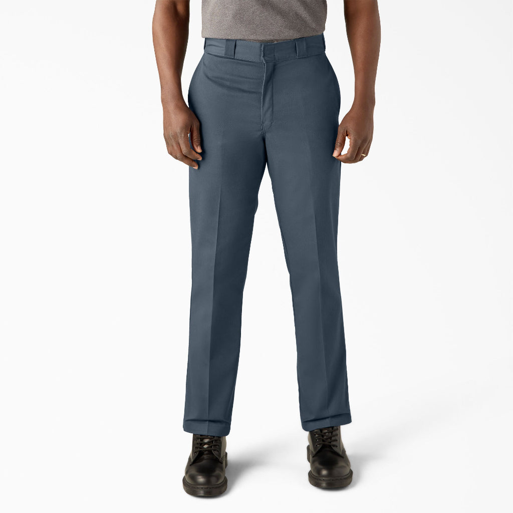 Person wearing air force blue pants on a white background