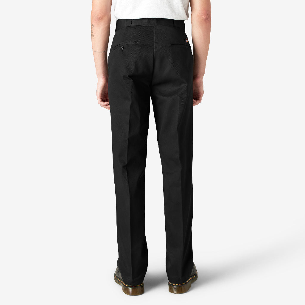 Person wearing black pants on a white background