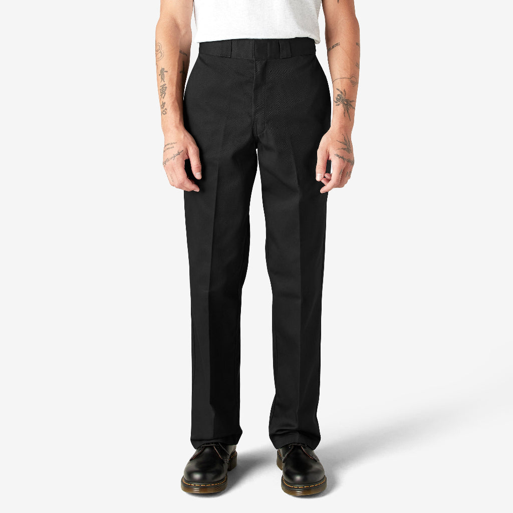 Person wearing black pants on a white background