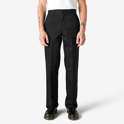 Person wearing black pants on a white background