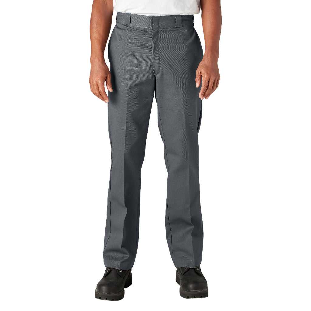 Person wearing gray pants on a white background