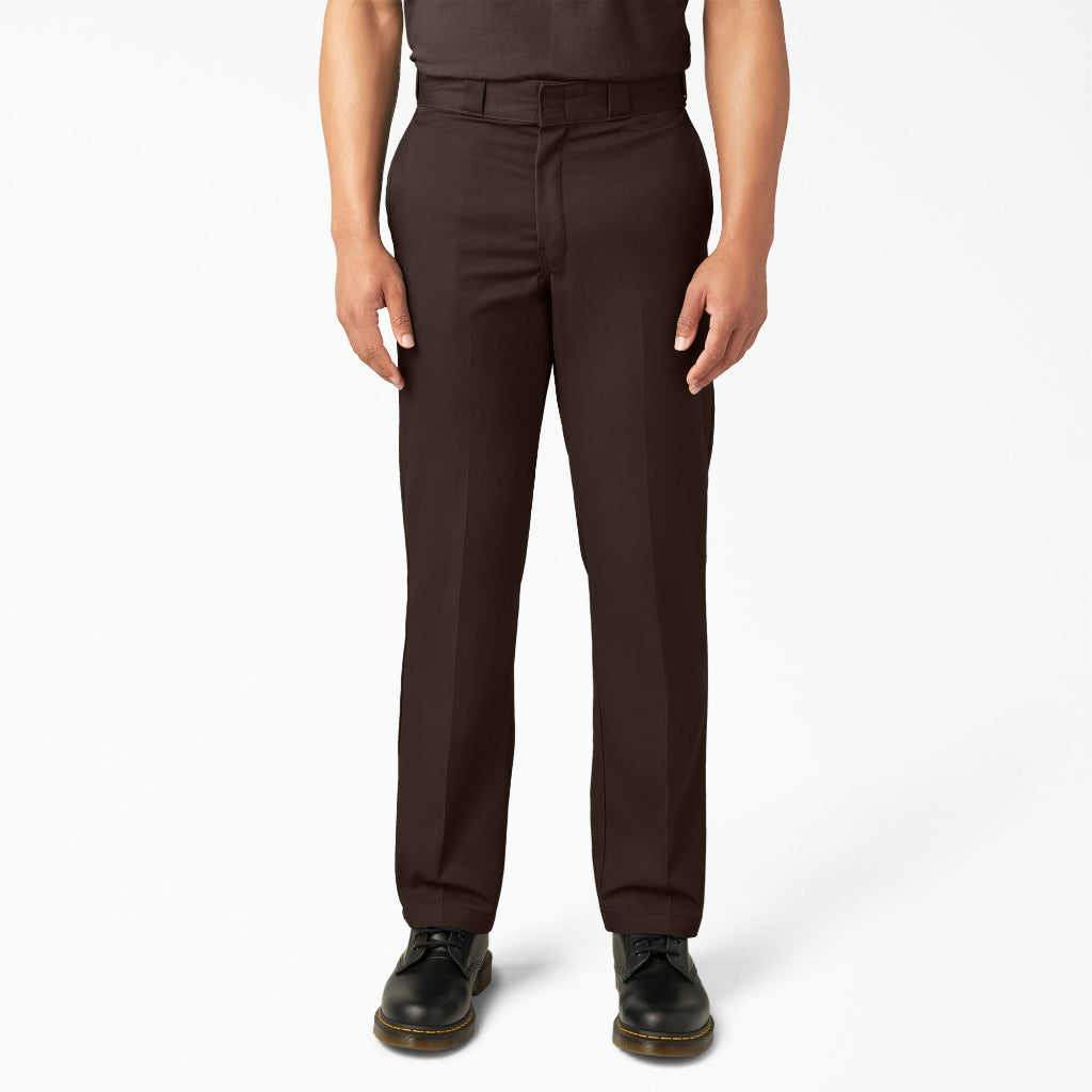 Brown pants worn by a person on a white background