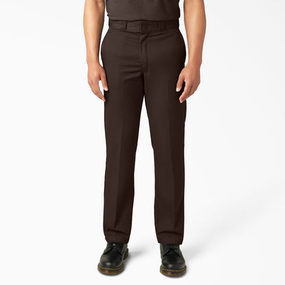 Brown pants worn by a person on a white background