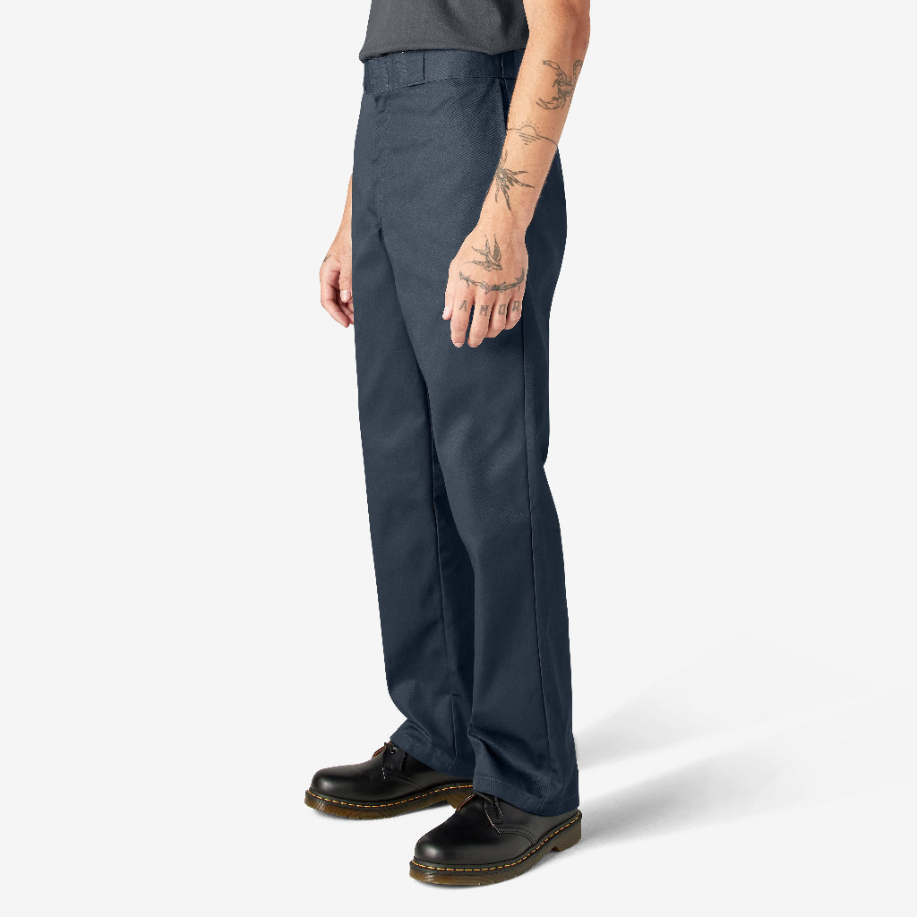 Person wearing navy pants on a white background