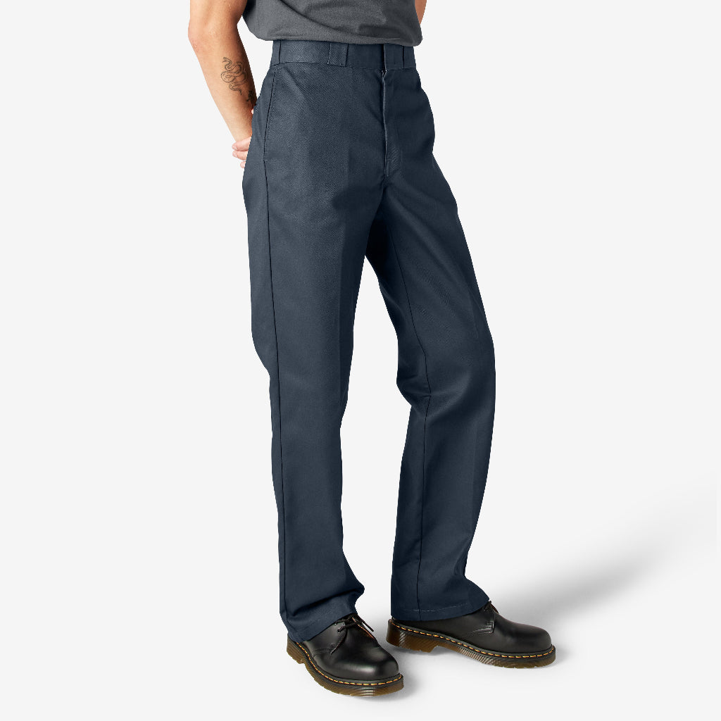 Person wearing dark navy pants on a white background
