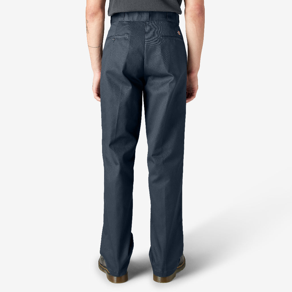 Person wearing dark navy pants on a white background