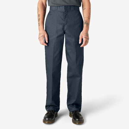 Person wearing dark navy pants on a white background