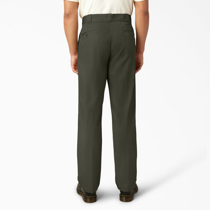Person wearing green pants on a white background