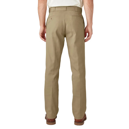 Beige pants worn by a person on a white background