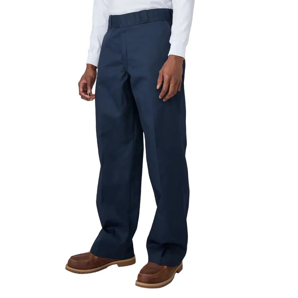 Navy pants worn by a person on a white background