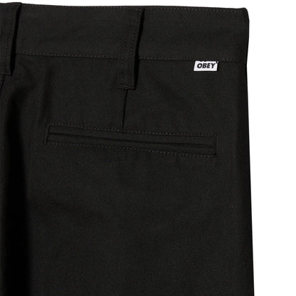 Black pants with a visible 'Obey' logo on a white background