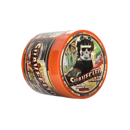 Container of Suavecito with colorful label on a white background