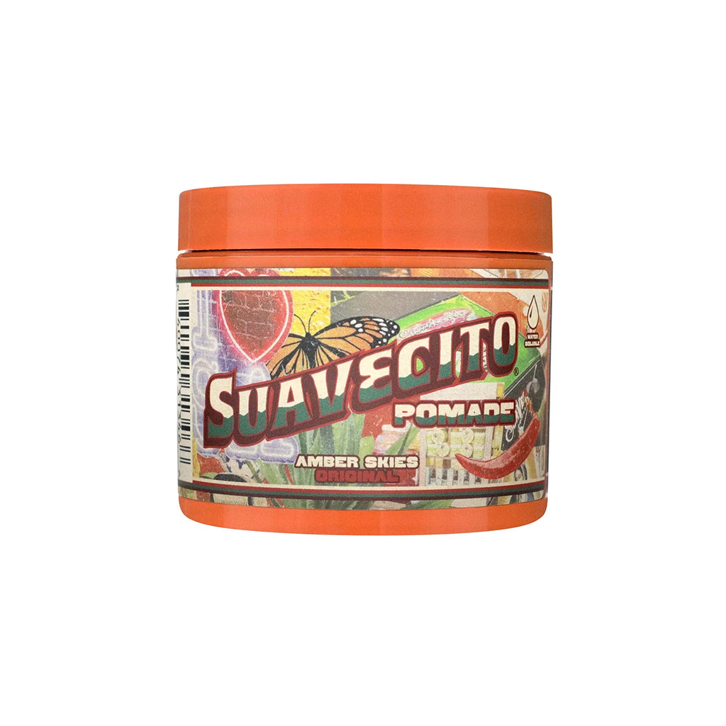 Jar of Suavecito Pomade with colorful label on a white background