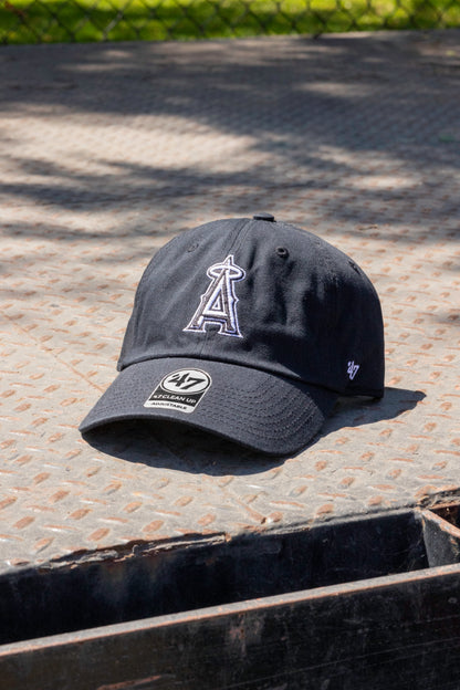 Black cap with a logo on a textured surface
