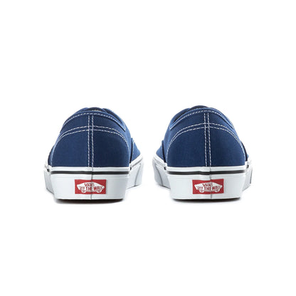 Pair of blue sneakers with white soles on a white background