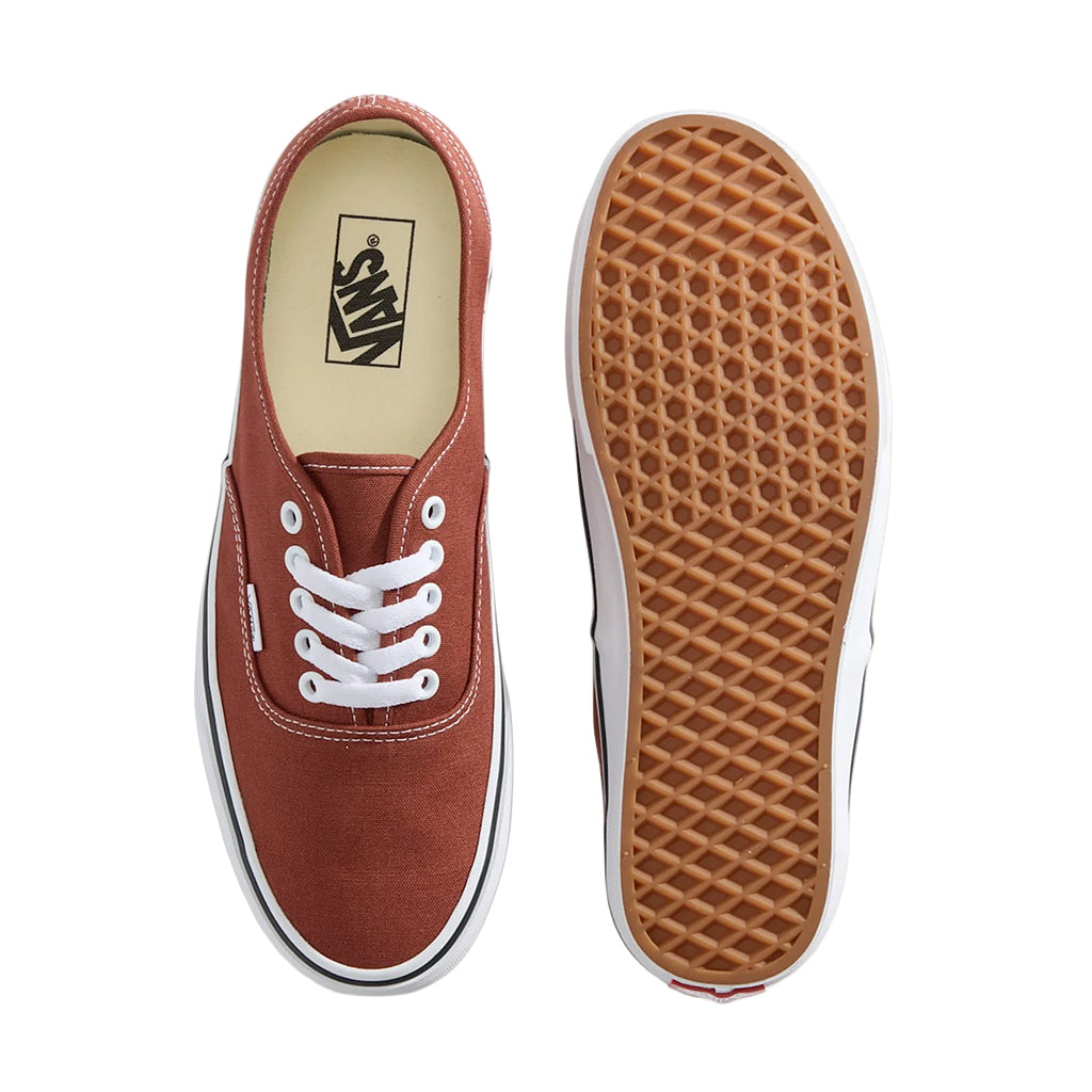 Brown Vans sneaker with white laces on a white background