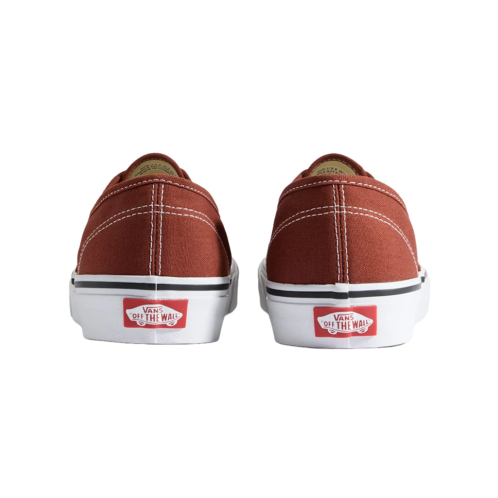 Brown sneakers with white soles and red 'Off The Wall' logo on a white background