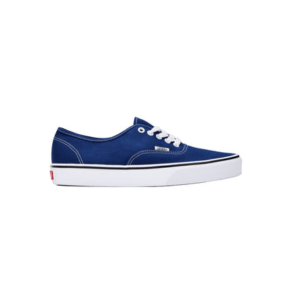 Blue sneaker with white laces on a white background