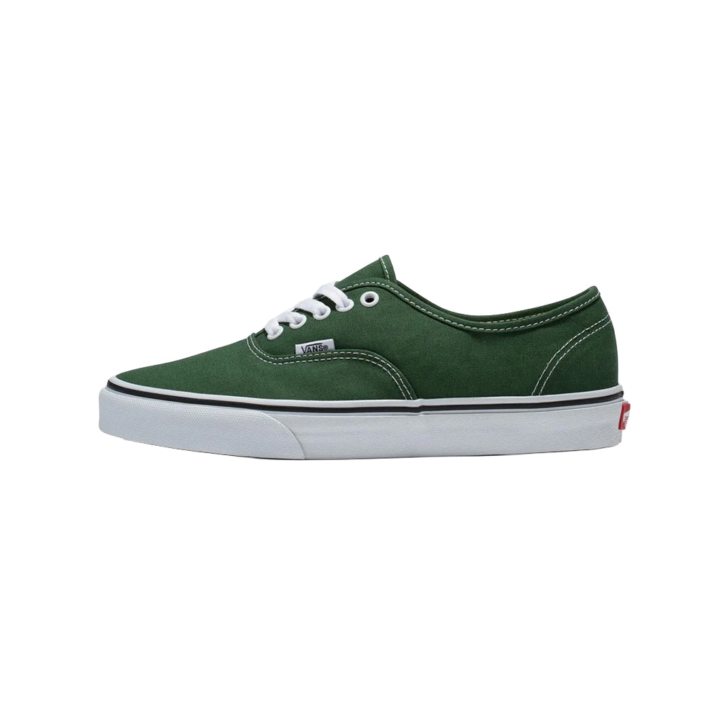 Green sneaker with white sole on a white background