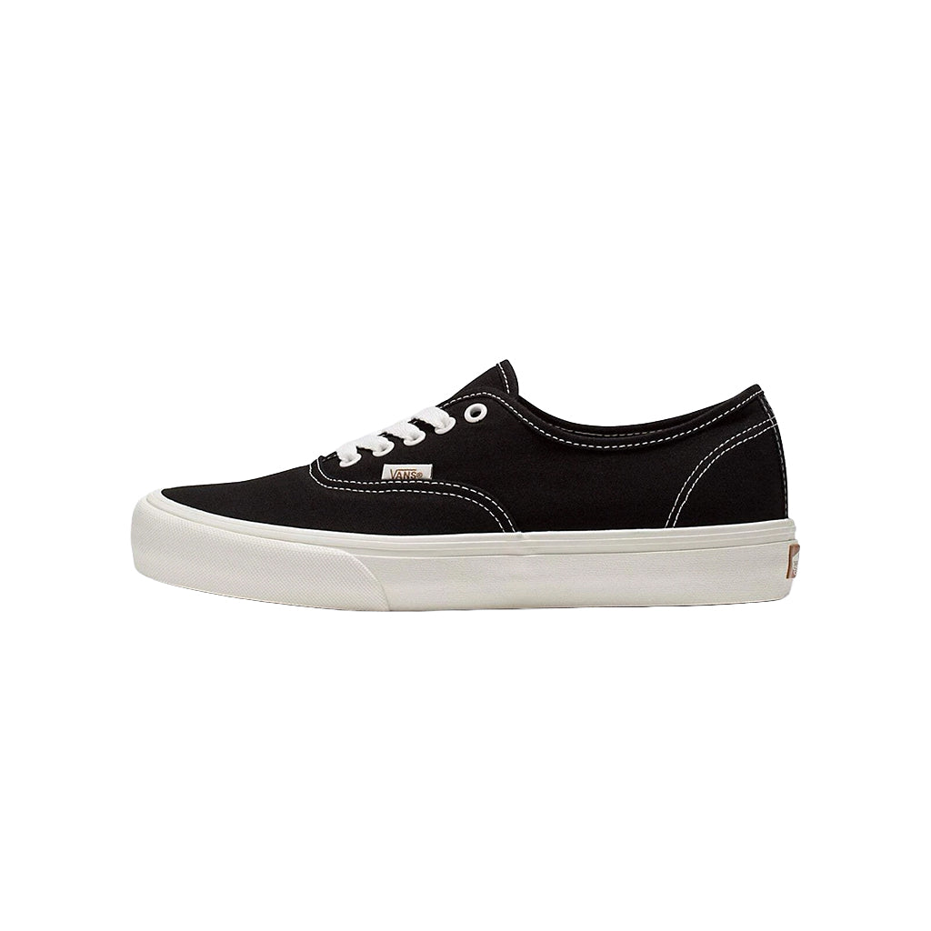 Black and white sneaker with a logo on a white background