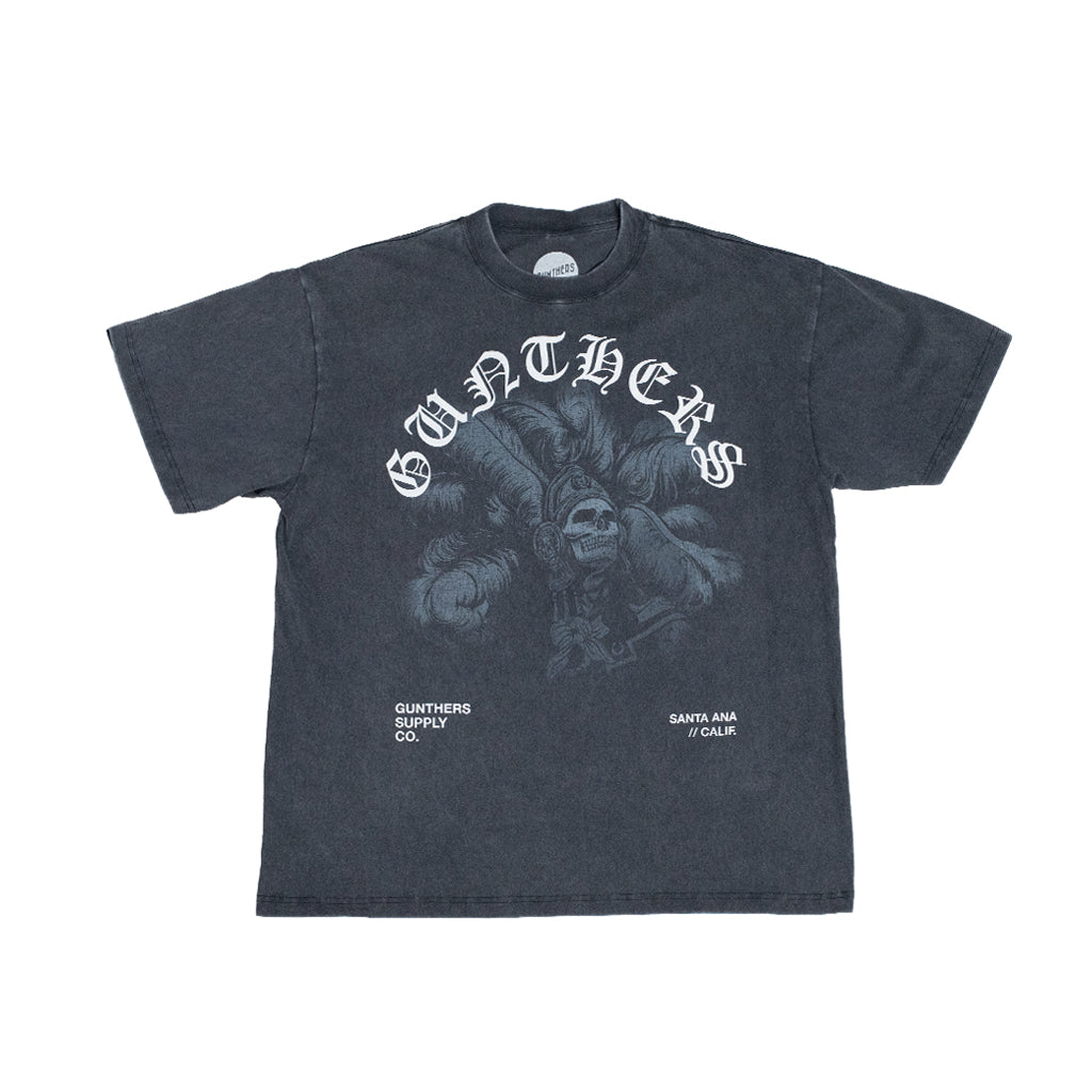 A dark charcoal gray short-sleeve t-shirt with a distressed graphic print. The design features the word 'GUNTHERS' in a stylized white gothic font arched over a detailed illustration 