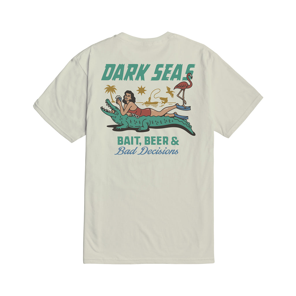 T-shirt with a graphic design featuring a woman on an alligator, text 'Dark Seas', and beach elements on a white background.