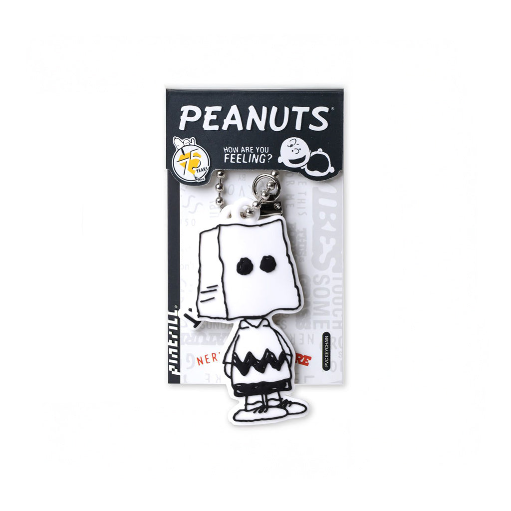 Peanuts character keychain on packaging with 'PEANUTS' branding