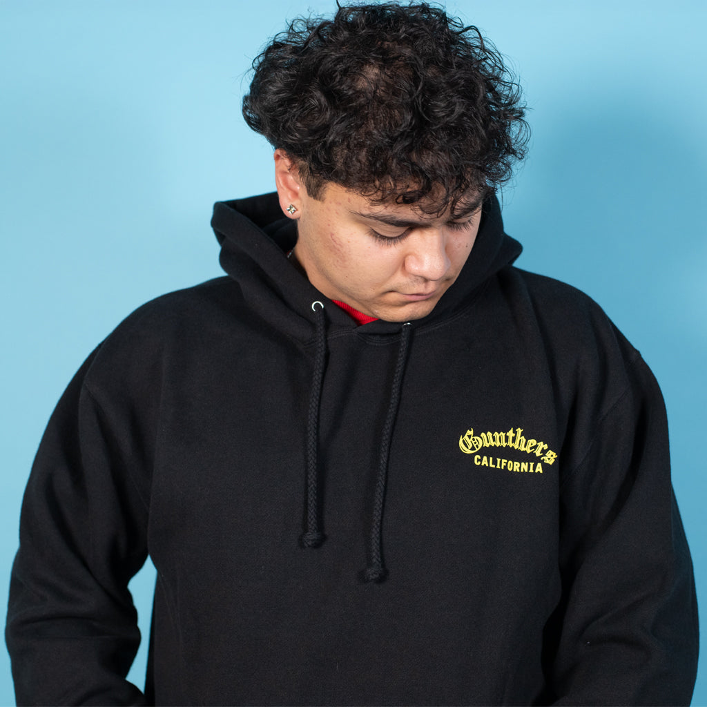 Person wearing a black hoodie with 'Southside California' text on a blue background