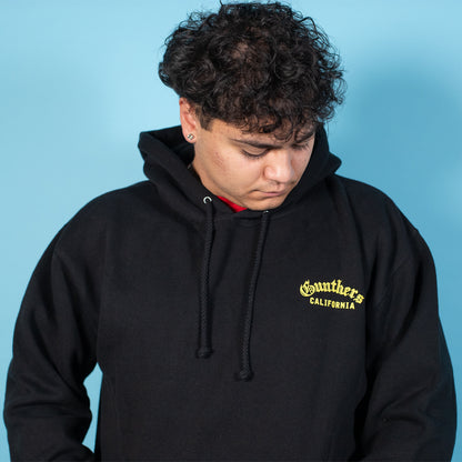 Person wearing a black hoodie with 'Southside California' text on a blue background