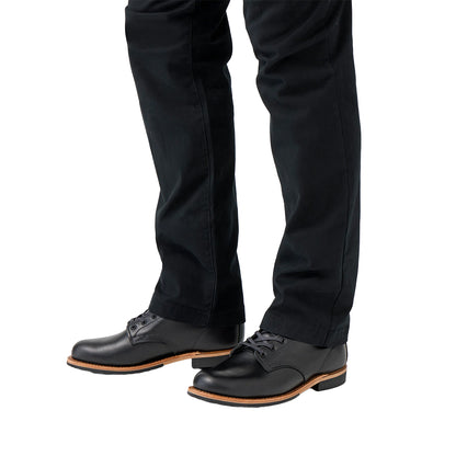 Black dress shoes and pants on a white background